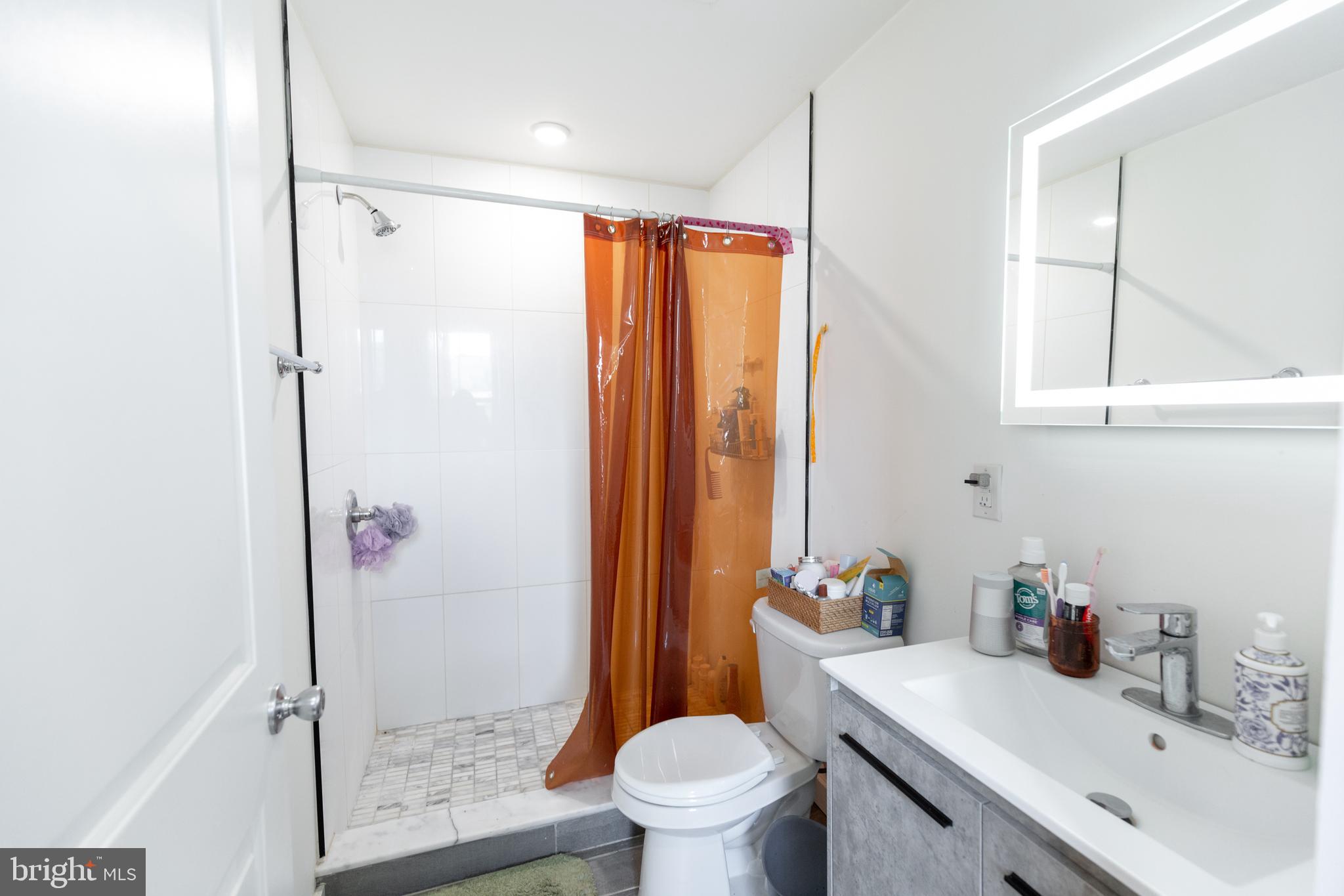 3945-49 Lancaster Avenue, Unit 3B Philadelphia, PA 19104 - Photo 13 of 28 a bathroom with a sink toilet and shower