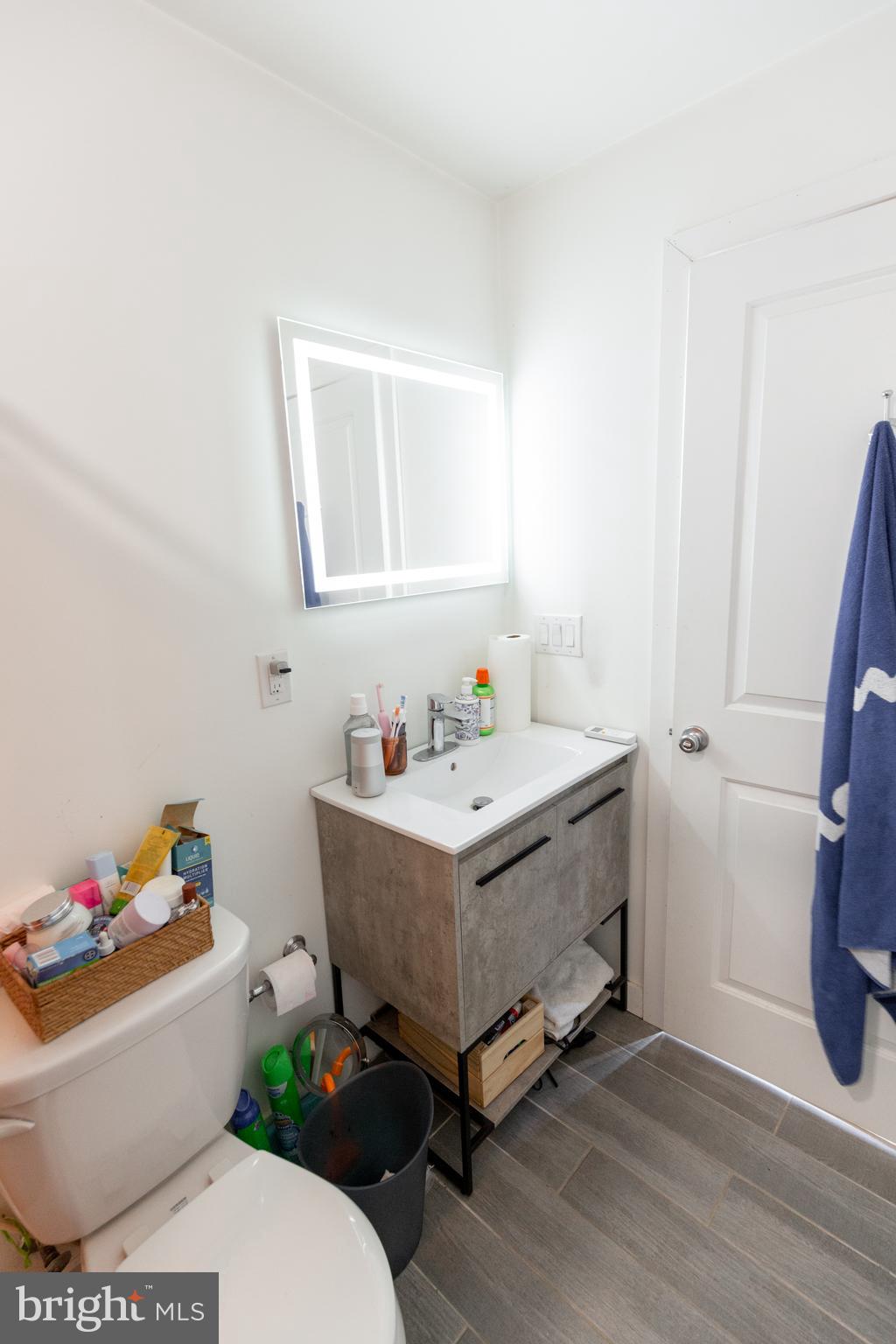 3945-49 Lancaster Avenue, Unit 3B Philadelphia, PA 19104 - Photo 14 of 28 a bathroom with a sink and a toilet