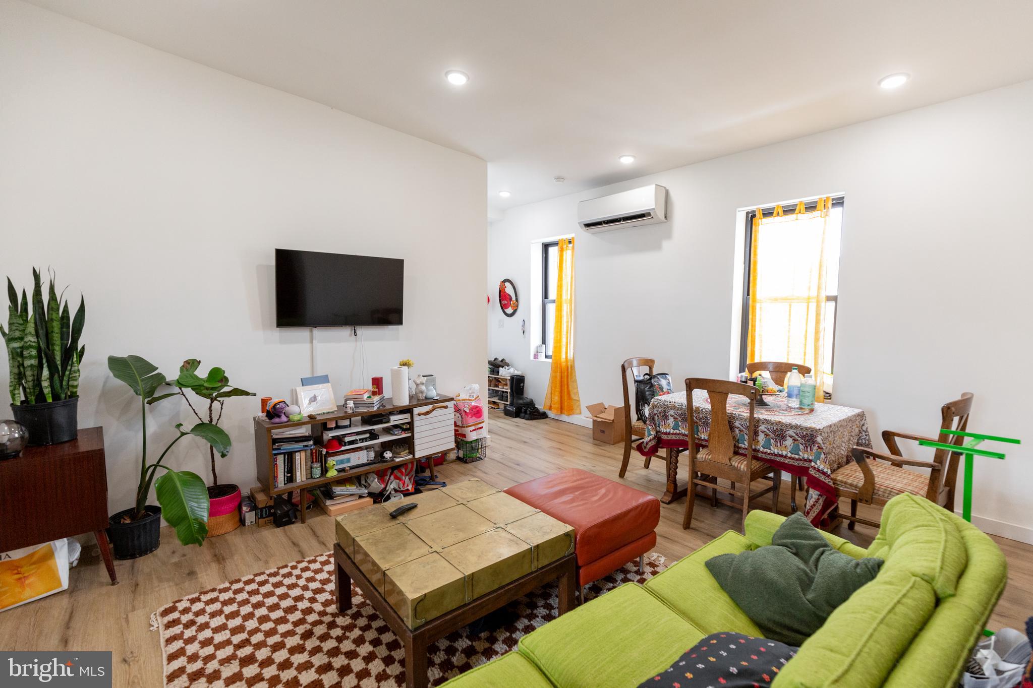 3945-49 Lancaster Avenue, Unit 3B Philadelphia, PA 19104 - Photo 17 of 28 a living room with furniture and a flat screen tv