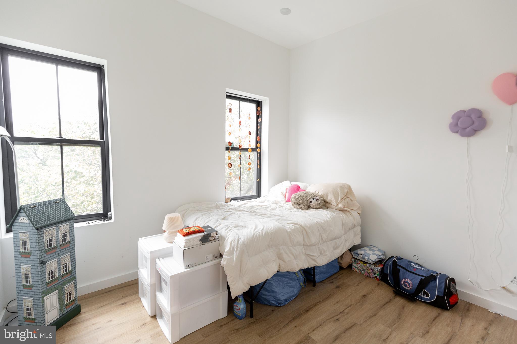 3945-49 Lancaster Avenue, Unit 3B Philadelphia, PA 19104 - Photo 20 of 28 a bedroom with a bed and window