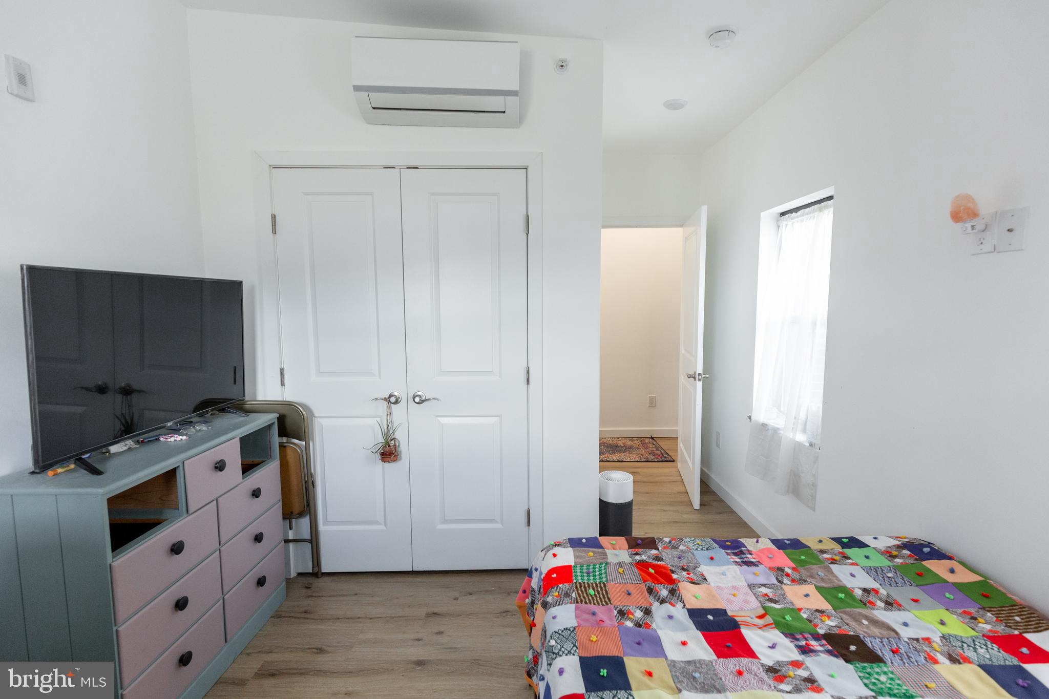 3945-49 Lancaster Avenue, Unit 3B Philadelphia, PA 19104 - Photo 9 of 28 a bedroom with bed and flat screen tv