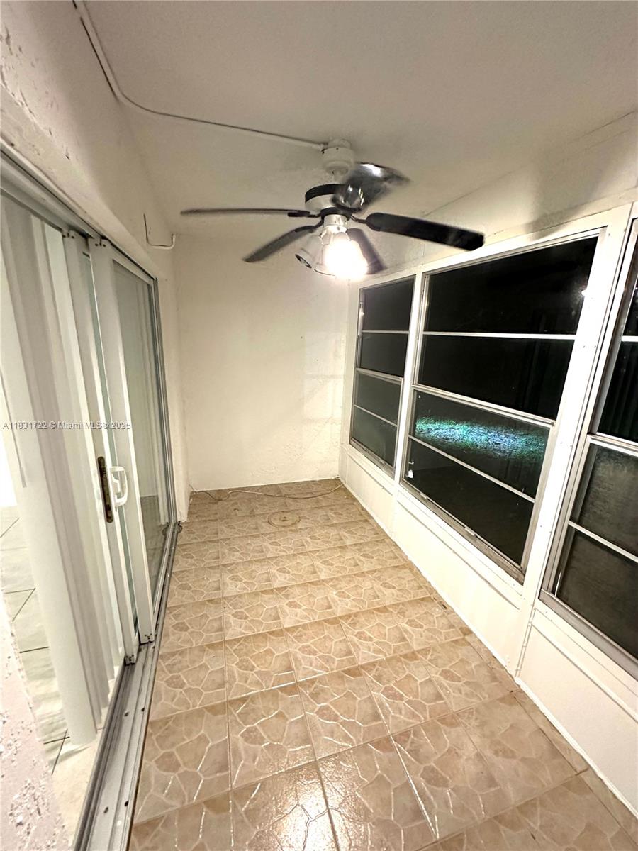 603 South State Road 7, Unit 1D Margate, FL 33068 - Photo 11 of 12 a view of walk in closet with empty racks