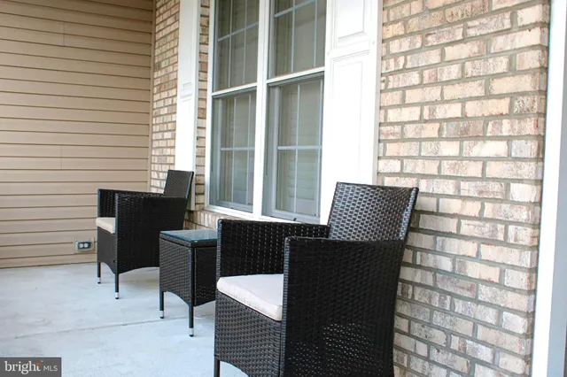 a view of a workspace with furniture