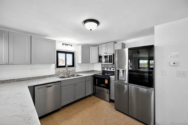 a kitchen with sink and window