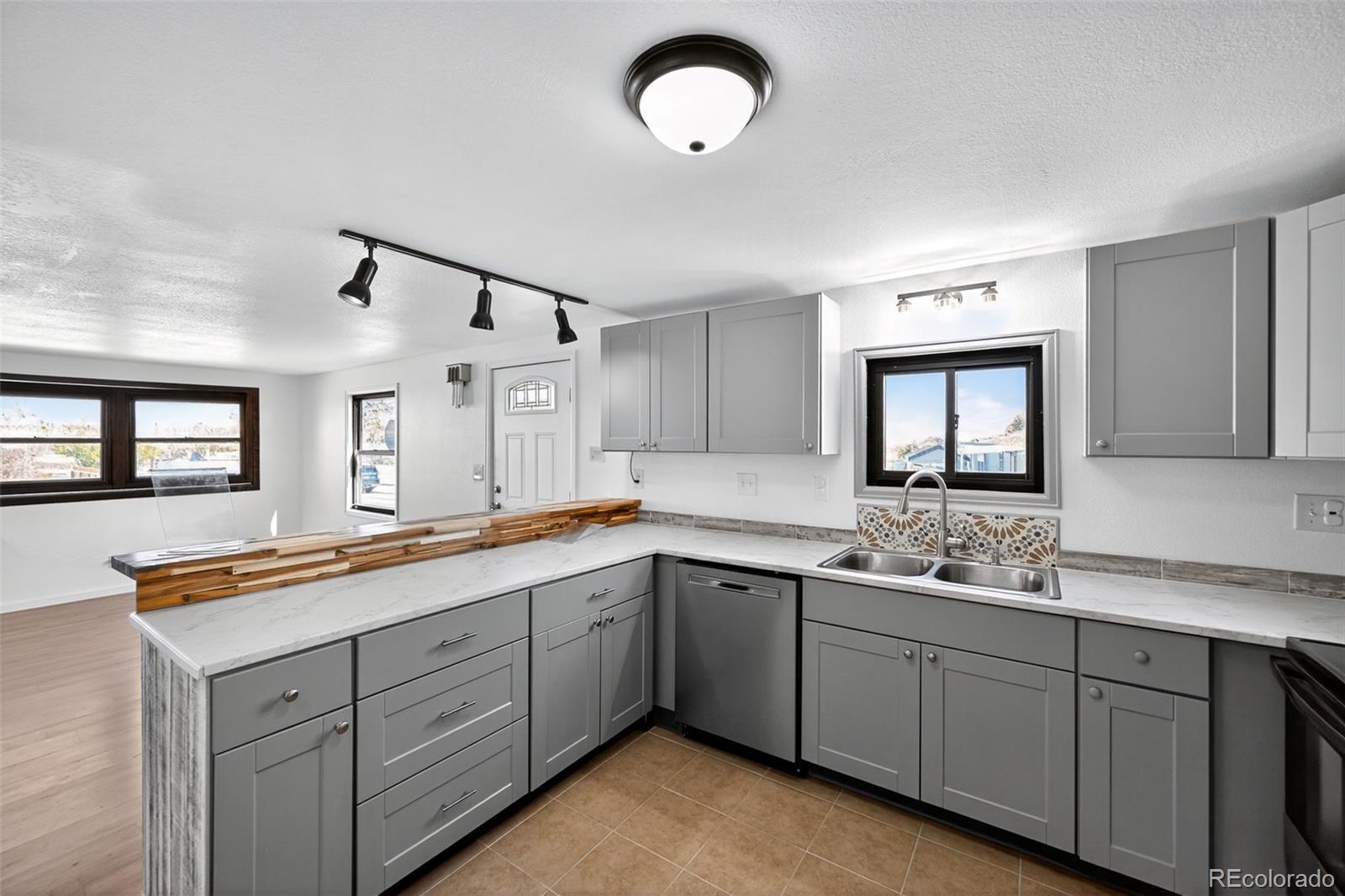 2000 Moselle Street Denver, CO 80260 - Photo 19 of 33 a kitchen with sink and window