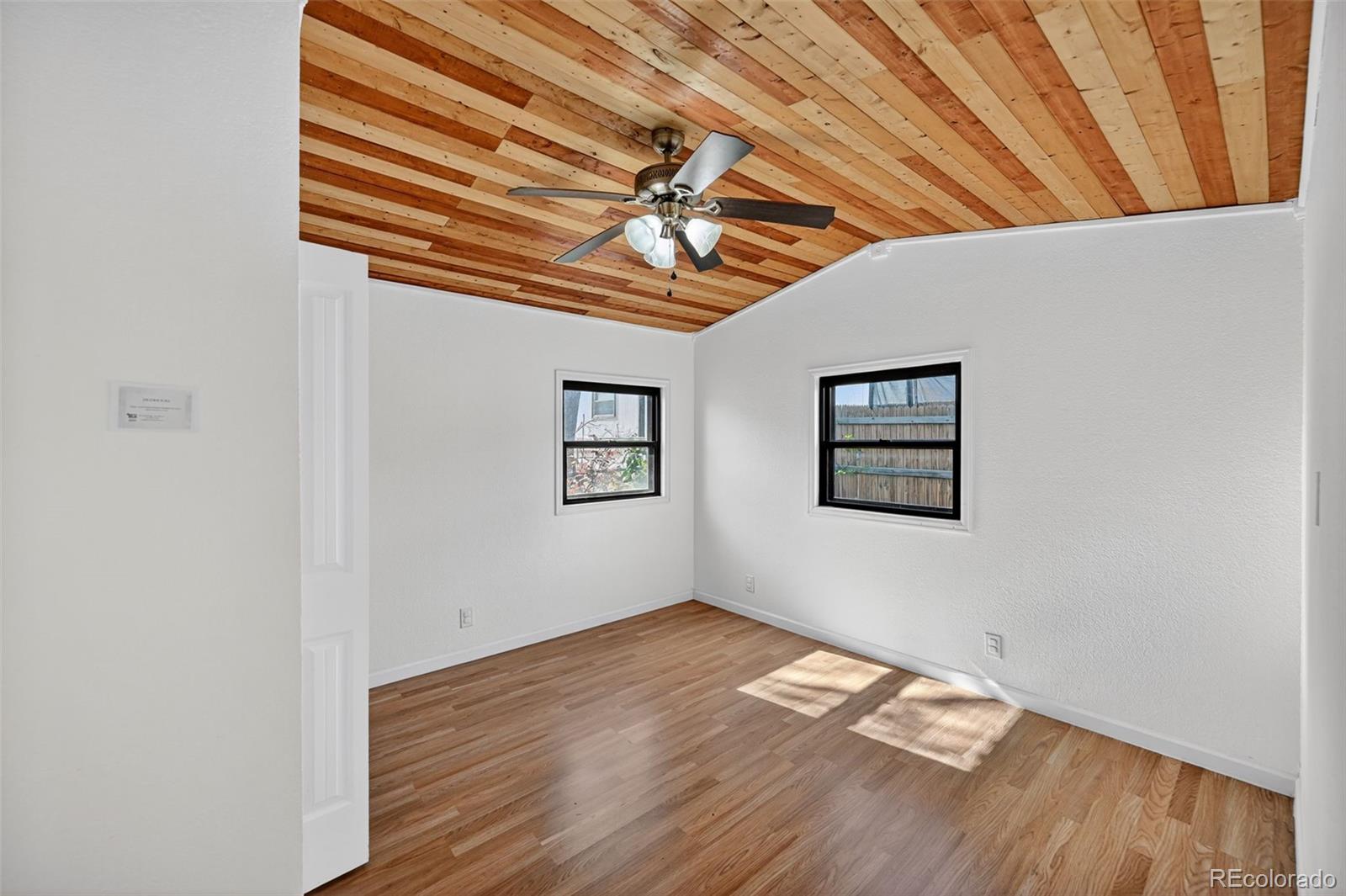 2000 Moselle Street Denver, CO 80260 - Photo 21 of 33 a view of empty room with wooden floor