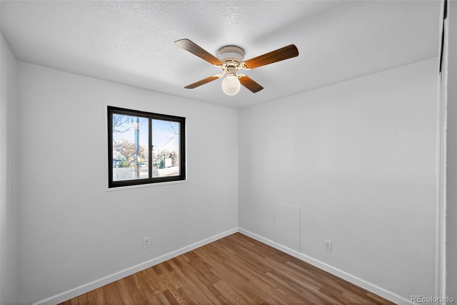 2000 Moselle Street Denver, CO 80260 - Photo 26 of 33 an empty room with windows and fan