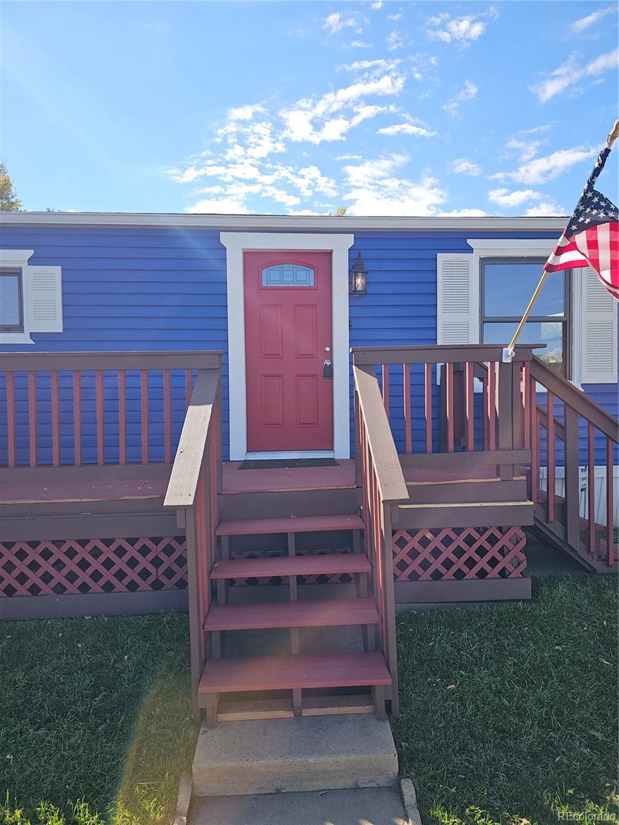 2000 Moselle Street Denver, CO 80260 - Photo 32 of 33 a view of a house with a small yard and wooden fence