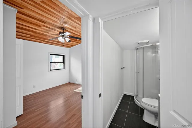 a bathroom with a tub sink shower and mirror