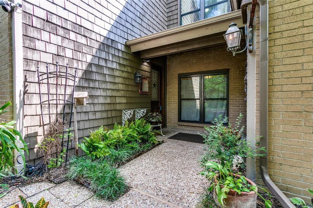 15615 Preston Road, Unit 1005 Dallas, TX 75248 - Photo 1 of 1 a view of a pathway besides a building