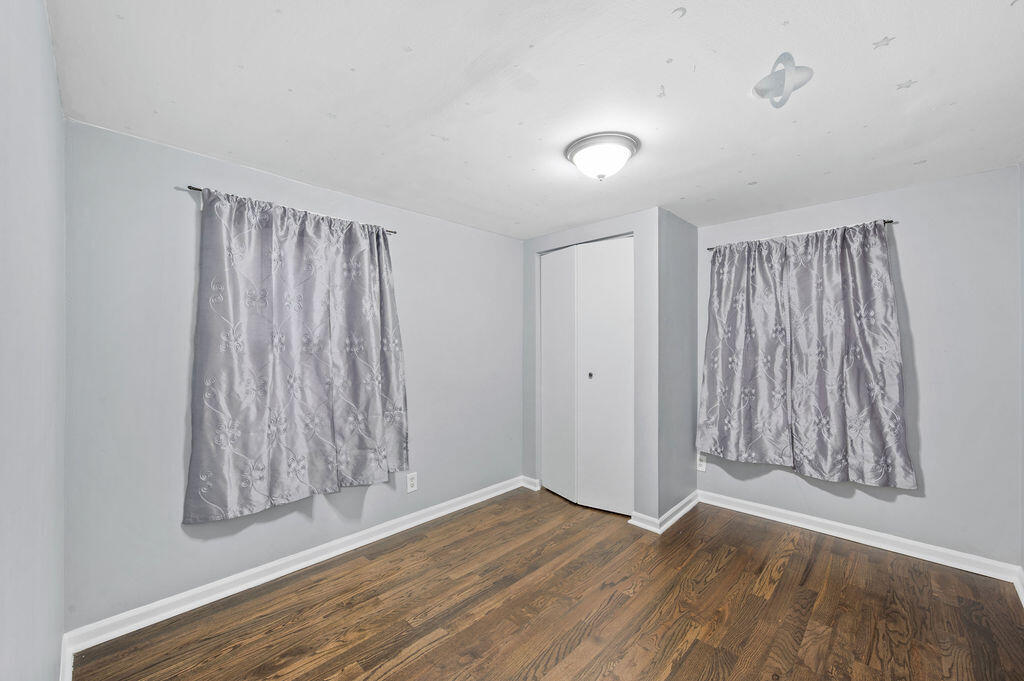 5631 Alice Avenue Hammond, IN 46320 - Photo 14 of 26 wooden floor in an empty room with a window