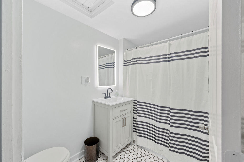 5631 Alice Avenue Hammond, IN 46320 - Photo 16 of 26 a bathroom with a sink toilet and shower