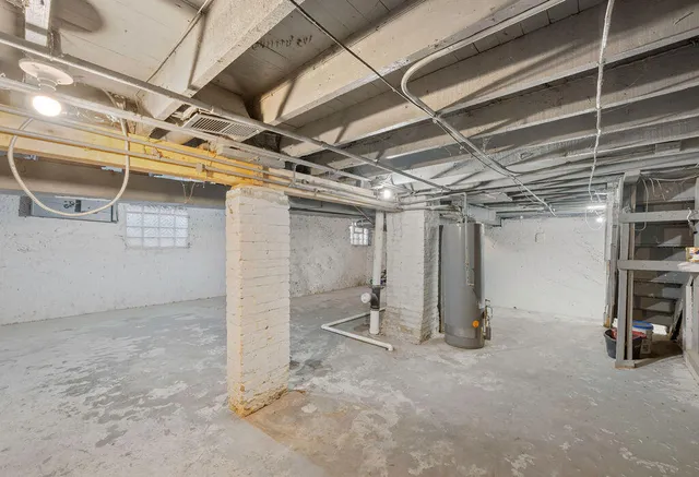 a view of empty room with wooden ceiling