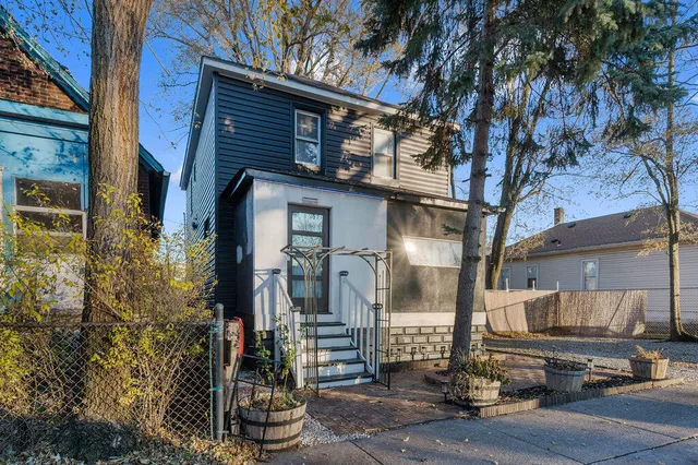 a front view of a house with street