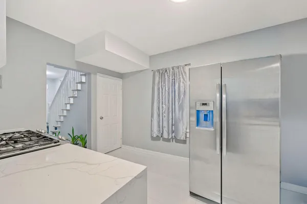 a bathroom with a shower and a sink