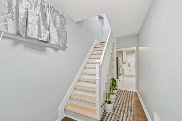 a view of entryway with wooden floor