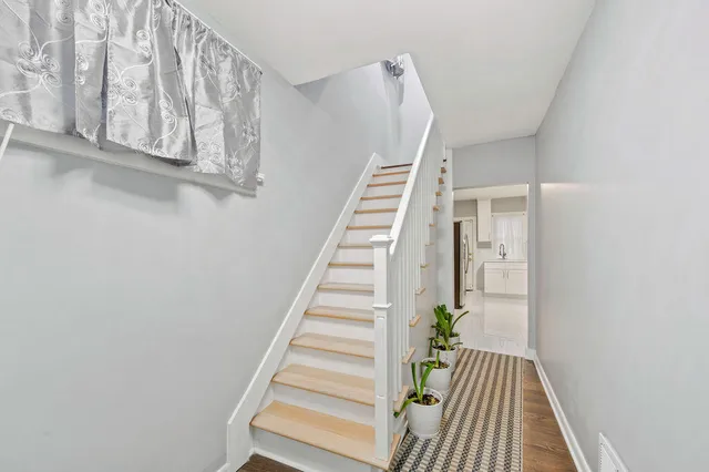 a view of entryway with wooden floor
