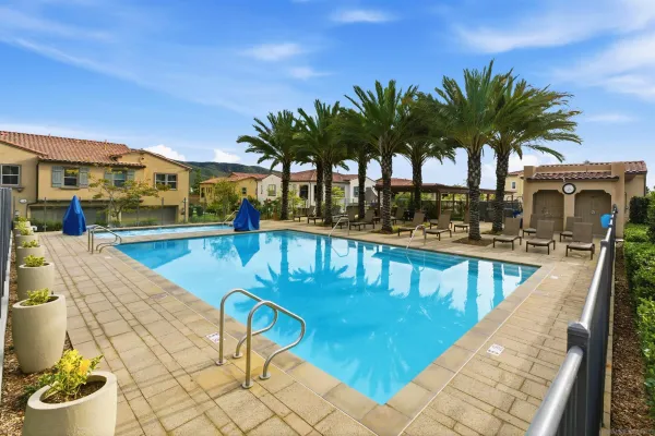 a swimming pool with outdoor seating and yard