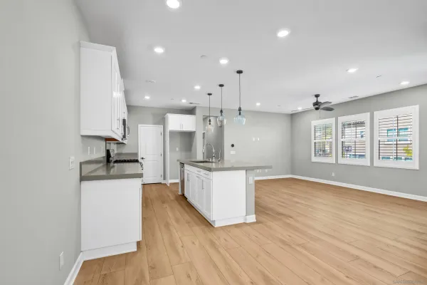 a large kitchen with stainless steel appliances granite countertop a large stove a sink and a refrigerator