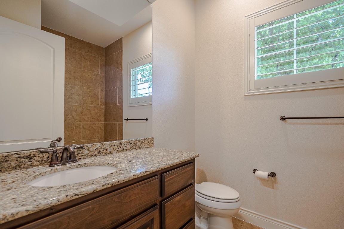 108-2 Rivalto Circle, Unit 5 Lakeway, TX 78734 - Photo 20 of 35 Full bath featuring vanity and toilet