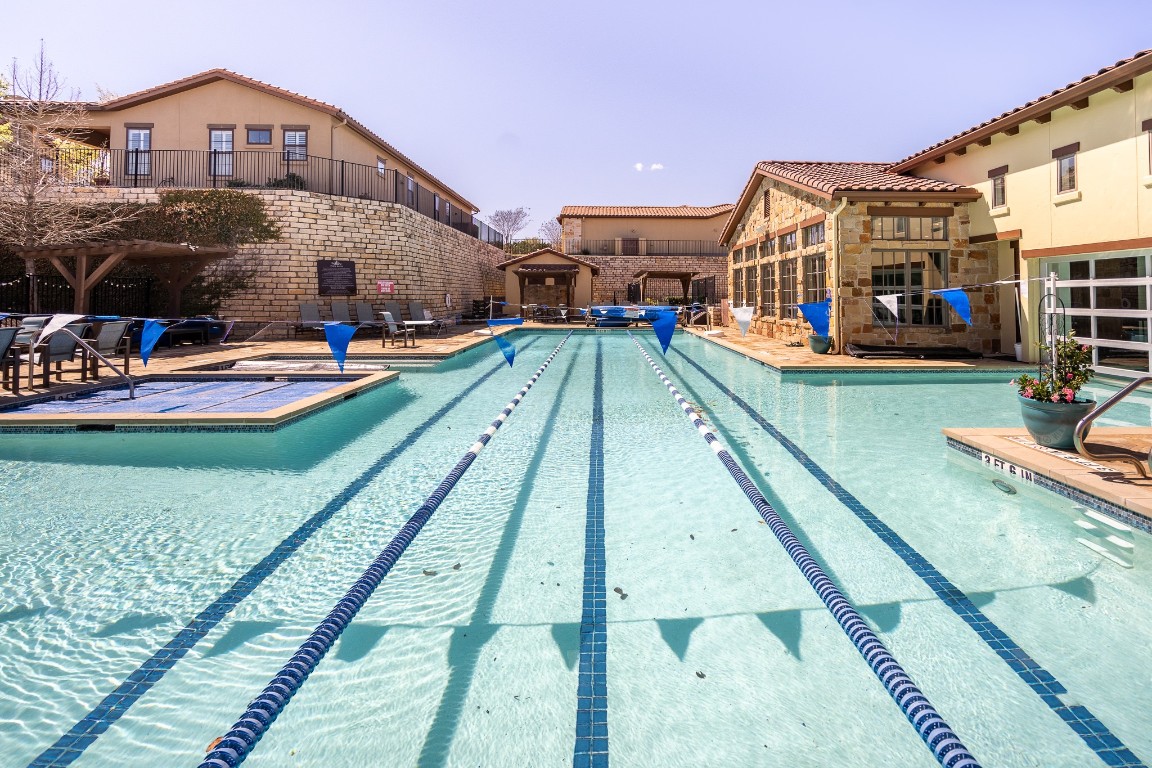 108-2 Rivalto Circle, Unit 5 Lakeway, TX 78734 - Photo 28 of 35 Community pool with a patio area and a balcony