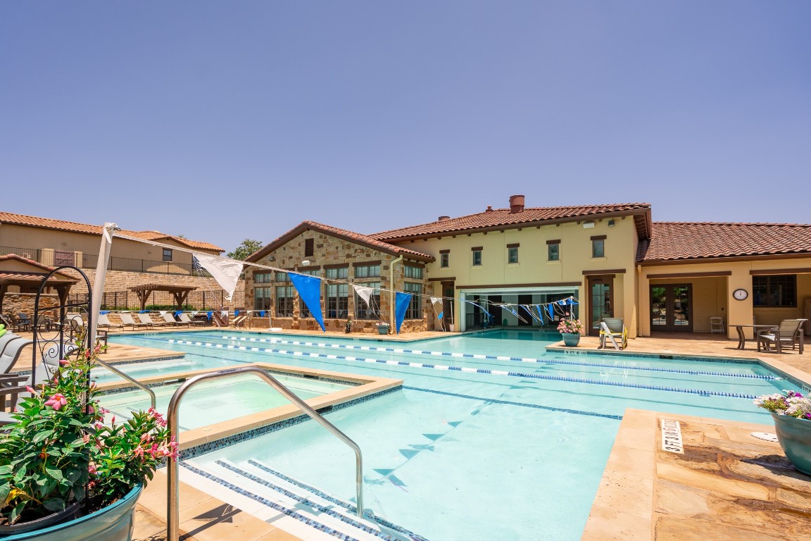 108-2 Rivalto Circle, Unit 5 Lakeway, TX 78734 - Photo 29 of 35 Community pool with a patio
