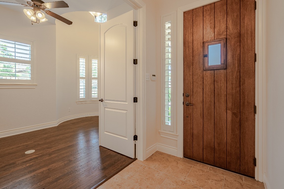 108-2 Rivalto Circle, Unit 5 Lakeway, TX 78734 - Photo 3 of 35 Foyer entrance featuring ceiling fan and wood finished floors