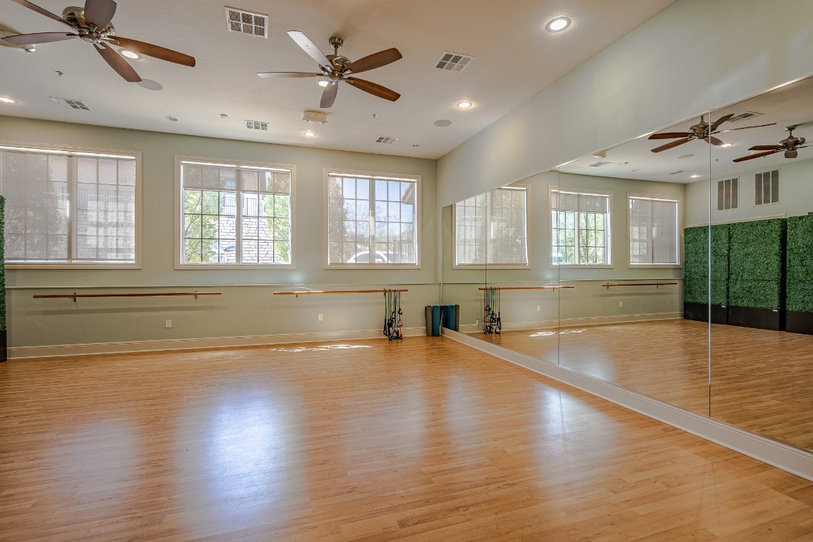 108-2 Rivalto Circle, Unit 5 Lakeway, TX 78734 - Photo 32 of 35 Exercise room with ceiling fan, light wood finished floors, and recessed lighting