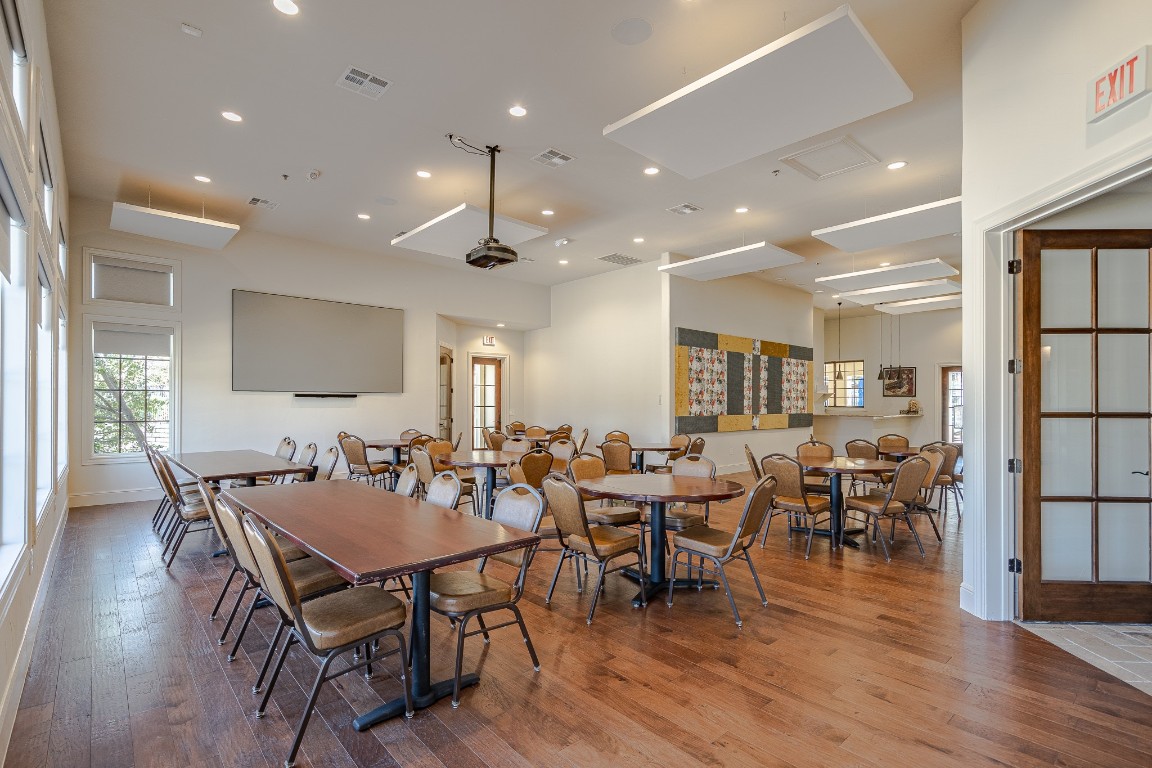 108-2 Rivalto Circle, Unit 5 Lakeway, TX 78734 - Photo 34 of 35 Dining space featuring hardwood / wood-style floors, healthy amount of natural light, and recessed lighting