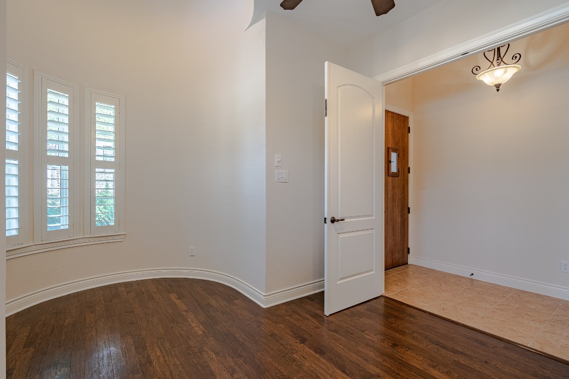 108-2 Rivalto Circle, Unit 5 Lakeway, TX 78734 - Photo 4 of 35 Unfurnished office featuring dark wood-style flooring and a ceiling fan