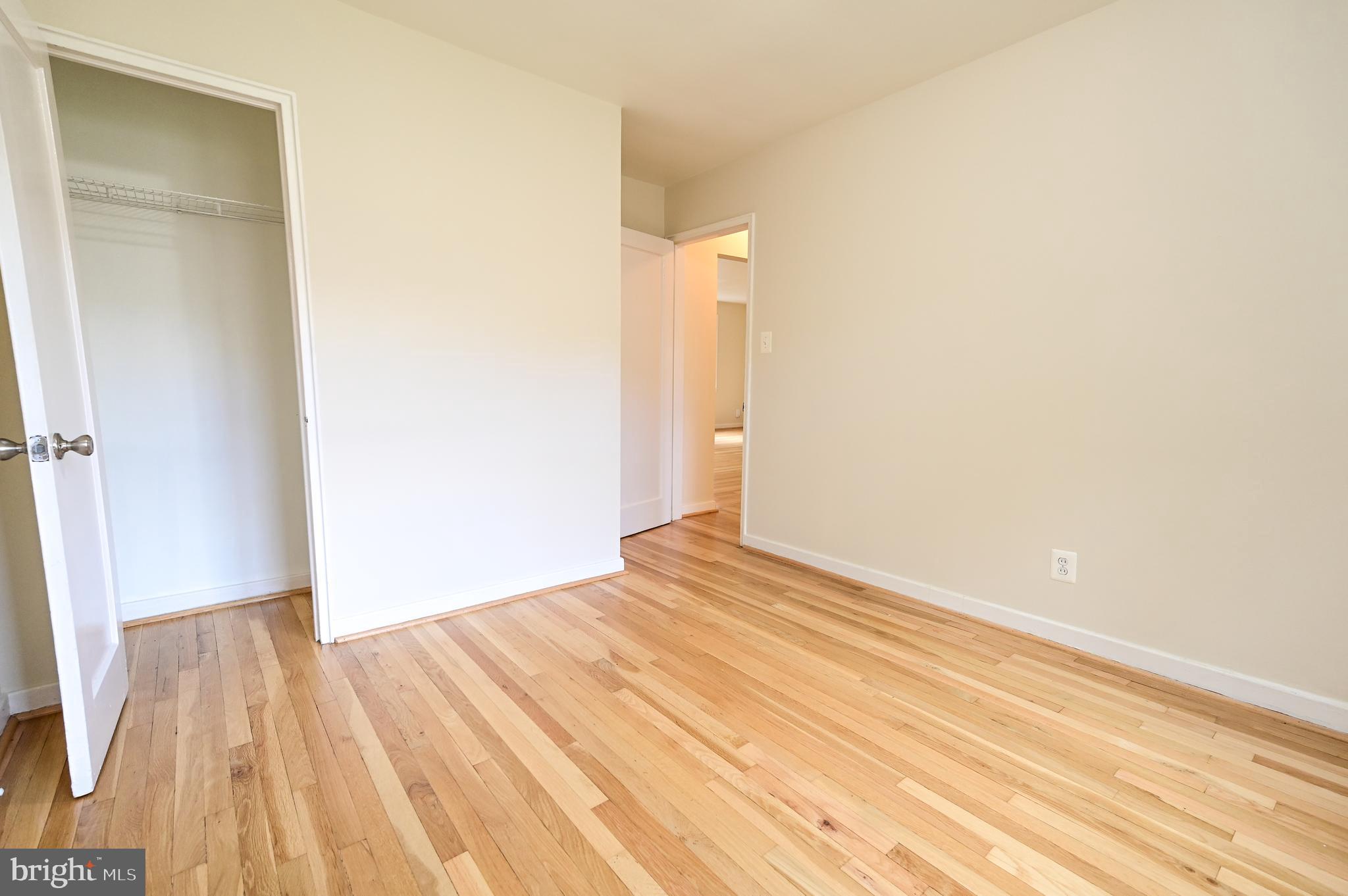 8331 Grubb Road, Unit G201 Silver Spring, MD 20910 - Photo 15 of 15 a view of empty room with wooden floor