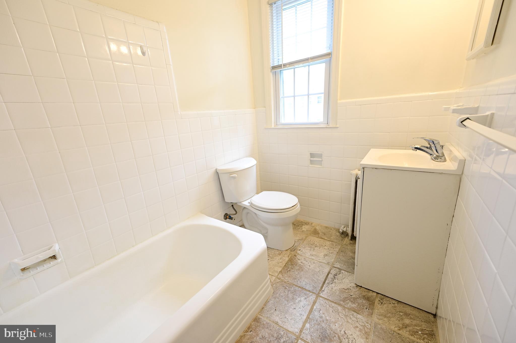 8331 Grubb Road, Unit G201 Silver Spring, MD 20910 - Photo 9 of 15 a bathroom with a sink and a toilet