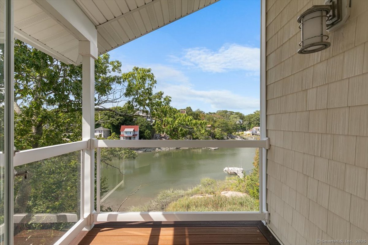33 Jefferson Place Branford, CT 06405 - Photo 22 of 37 Covered deck off of the primary bedroom. Imagine how good your morning coffee would taste from here!
