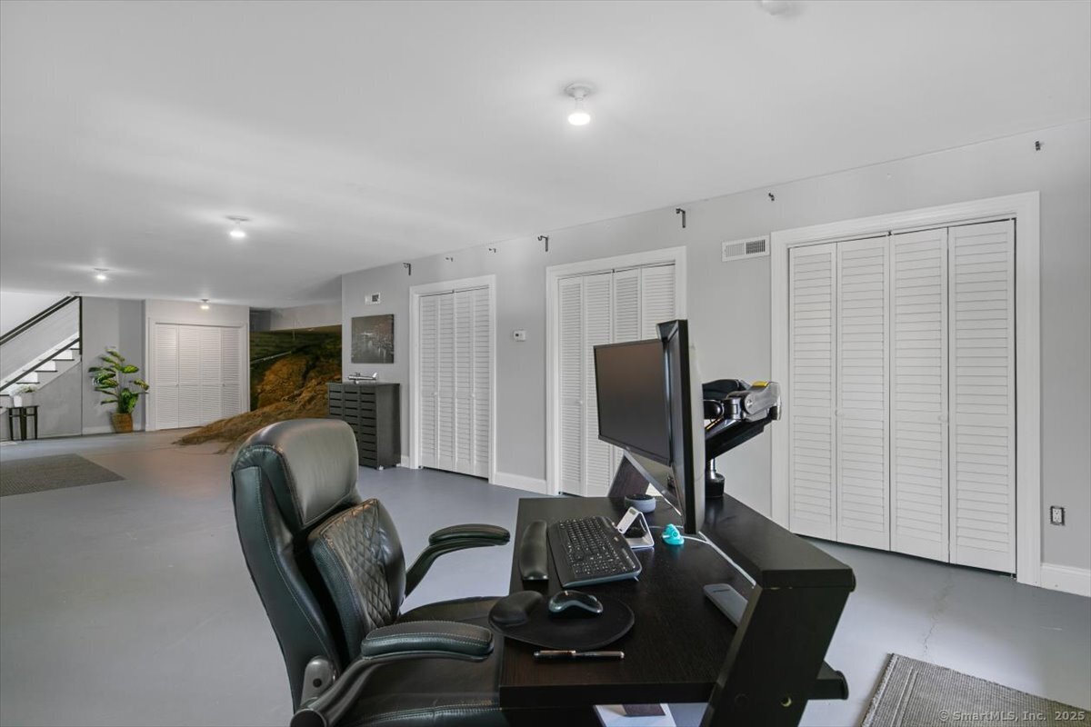 33 Jefferson Place Branford, CT 06405 - Photo 34 of 37 Entry level with storage and office/rec room space. Plus a walkout to one of the 3 decks overlooking the water