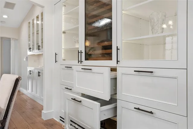 a bed room with a bed and a chandelier