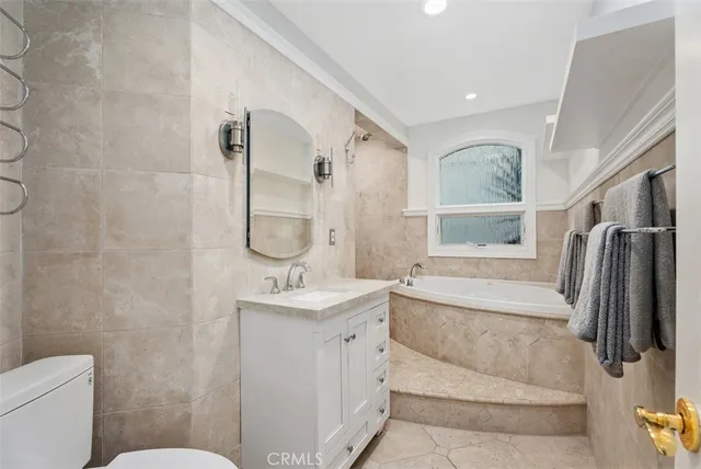 a bedroom with a bed cabinet and a window