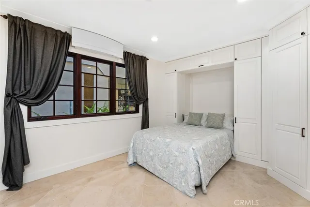 a view of a big room with windows and entryway