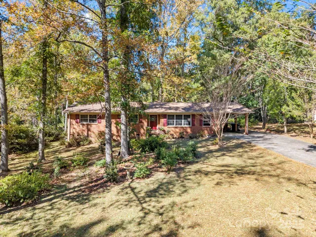 a view of a chairs in front of a house