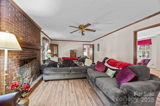 a living room with furniture and flowers