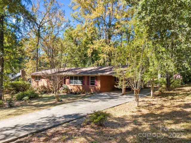 a view of house with outdoor space and sitting area