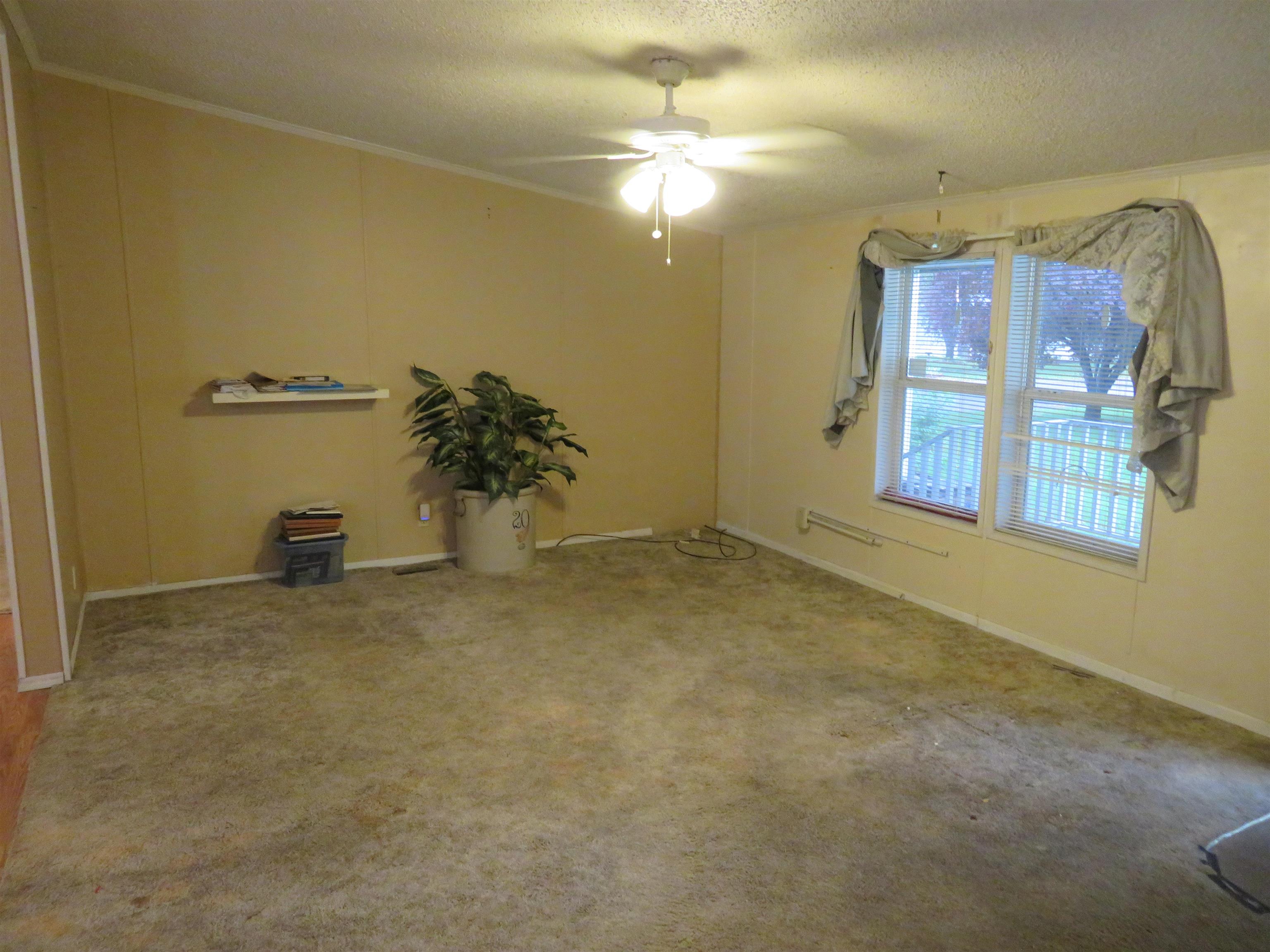 435 32 Road, Unit 508 Clifton, CO 81520 - Photo 3 of 26 an empty room with windows and ceiling fan