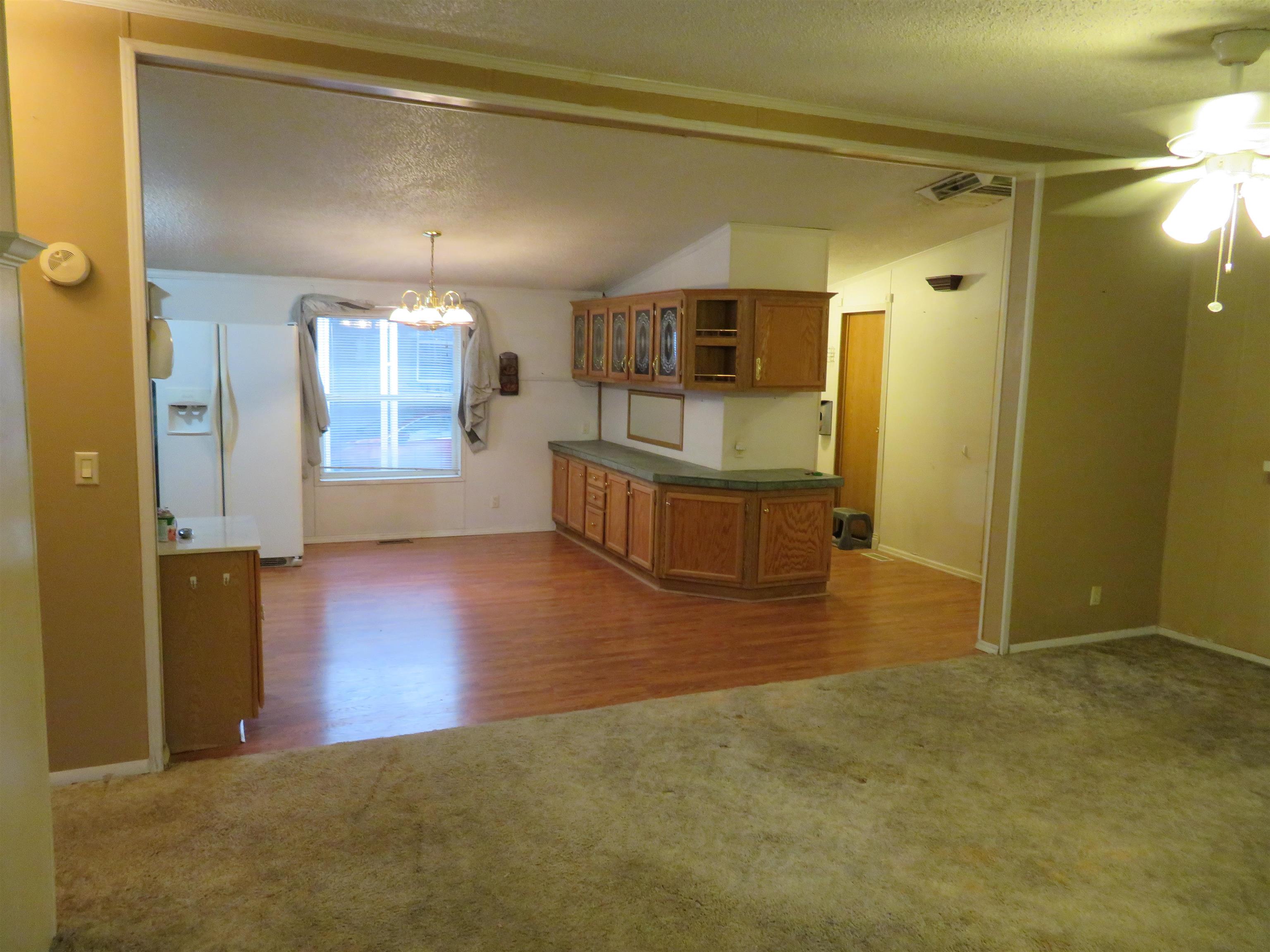 435 32 Road, Unit 508 Clifton, CO 81520 - Photo 4 of 26 a view of a big room with wooden floor and a bathroom