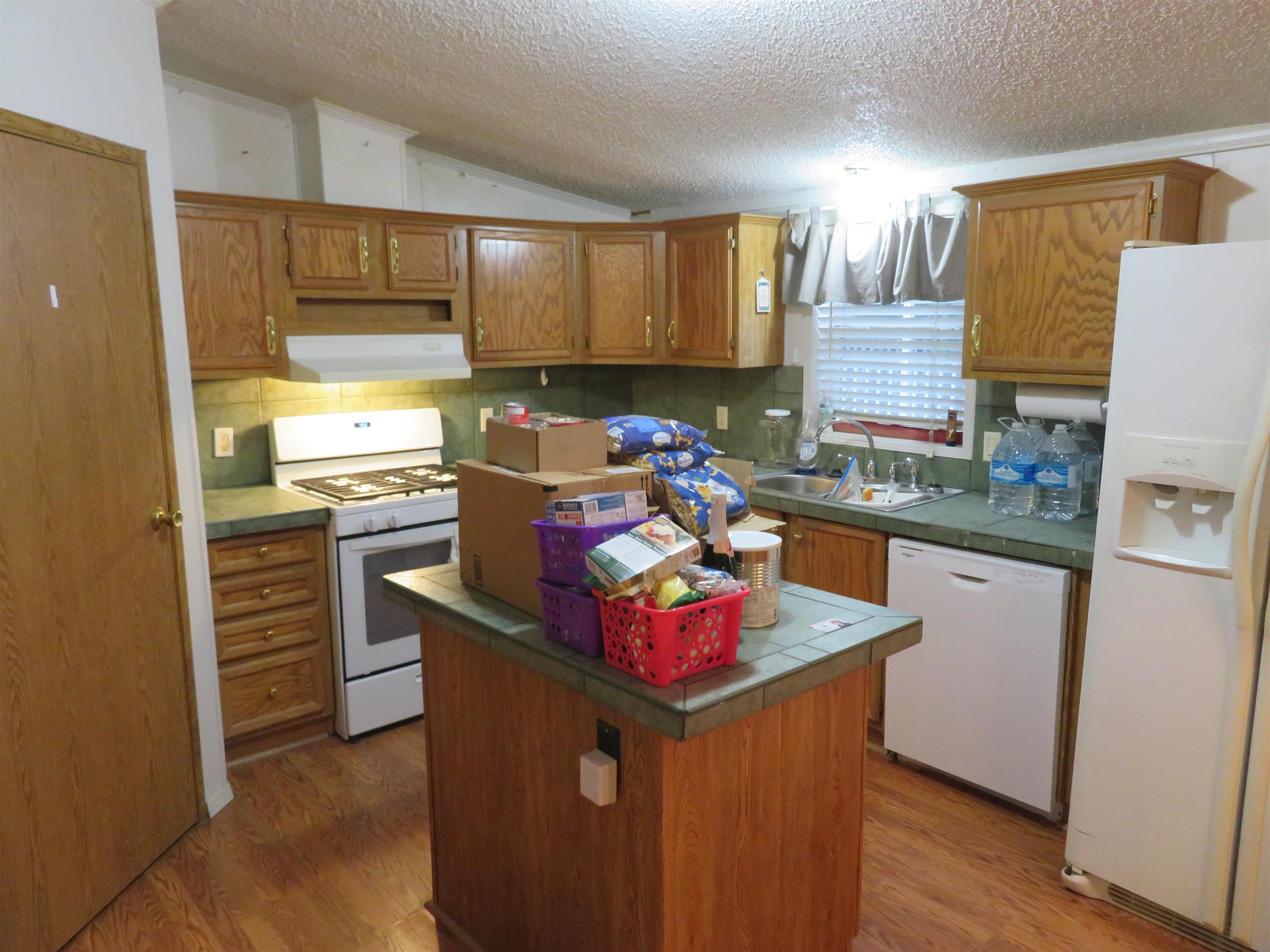 435 32 Road, Unit 508 Clifton, CO 81520 - Photo 9 of 26 a kitchen with stainless steel appliances granite countertop a stove a refrigerator and a sink