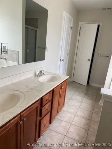 a toilet sitting in a bathroom next to a window