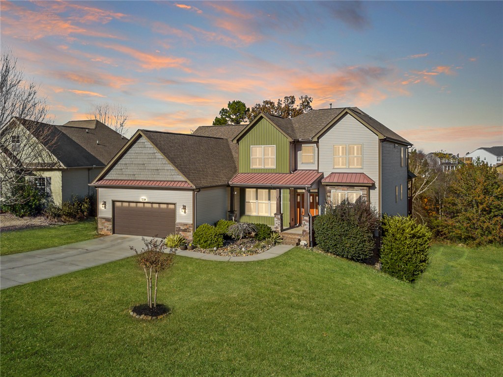 This charming residence features a well-maintained lawn and an inviting facade.