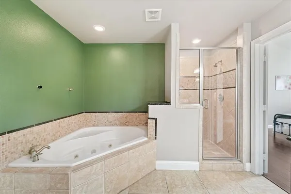 a view of walk in closet with clothes