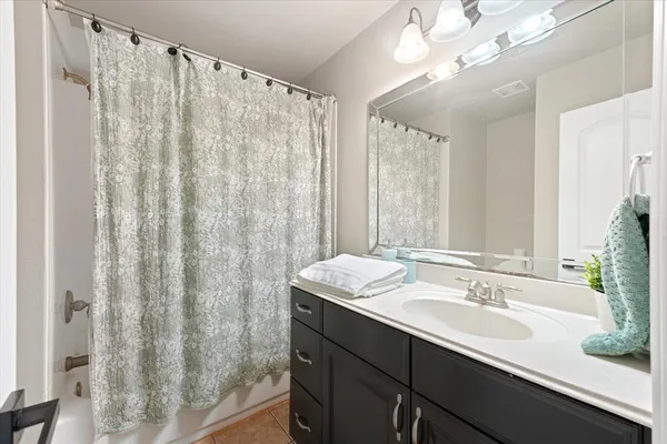 a bedroom with a large bed and a large window