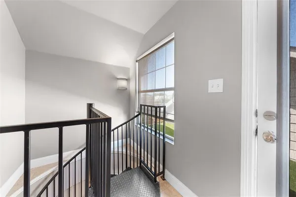 a view of entryway with wooden floor and stairs