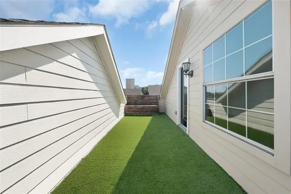 a view of a backyard with sitting area