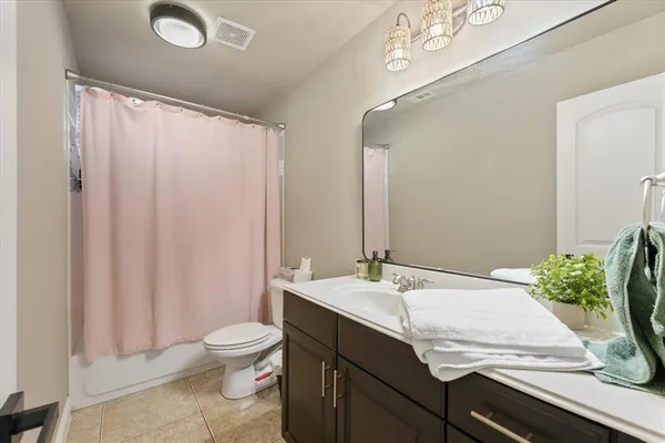 a view of balcony with two chairs and a gate